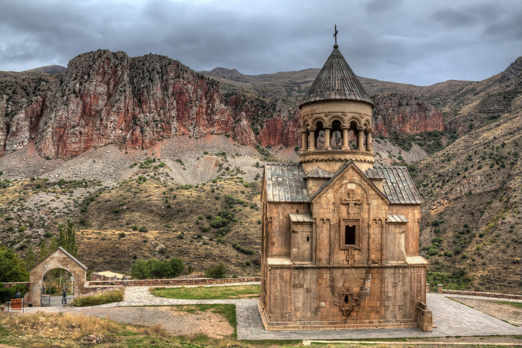 Monastary Noravank in gorge surrounded by red cliffs