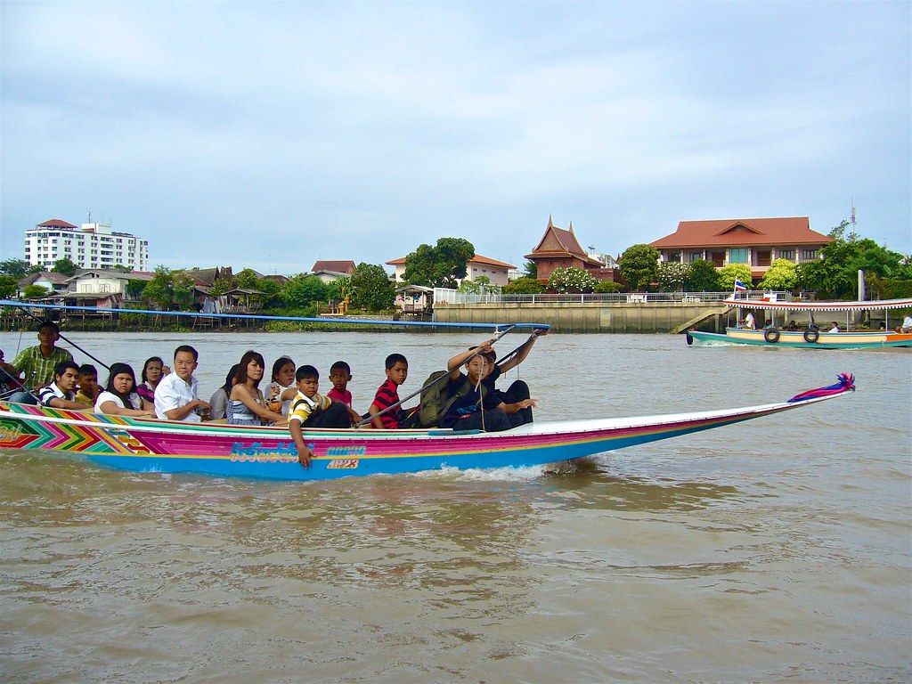 boats on the Chao Phraya river next to Ko Kret island Bangkok Thailand